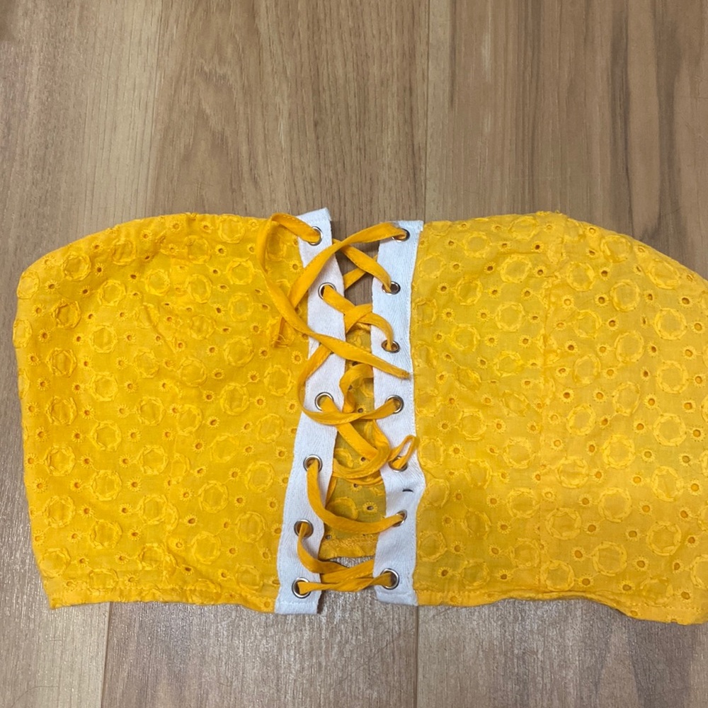 Yellow cropped top. Ties at front